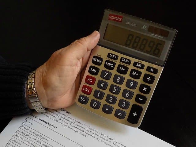 Calculator and budget notes for a home down payment
